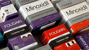 箱に入った各種FOLIGAINミノキシジルとTRIOXIDILのヘアケア製品。